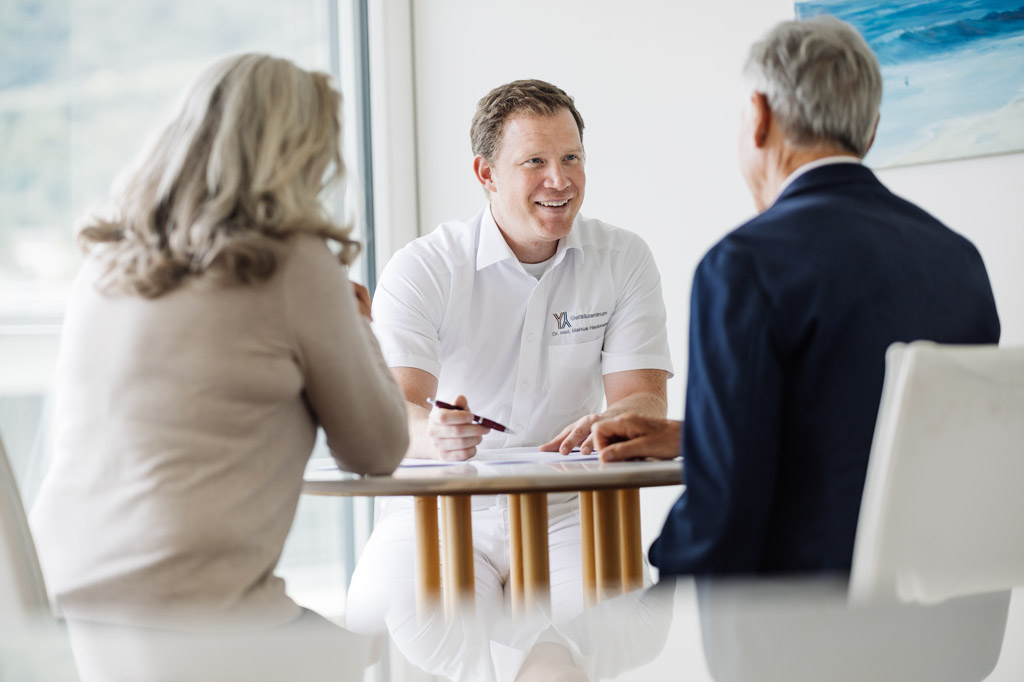Doctor talks to patients