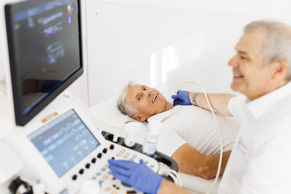 Patient and doctor during an ultrasound examination of the thyroid gland